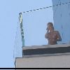 Бритни болтает по телефону на террасе в гостинице The Palms 15 июня 2008 года